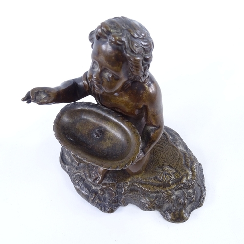 229 - 19th century patinated bronze figure of a boy holding a basket, unsigned, height 12cm, width 12cm