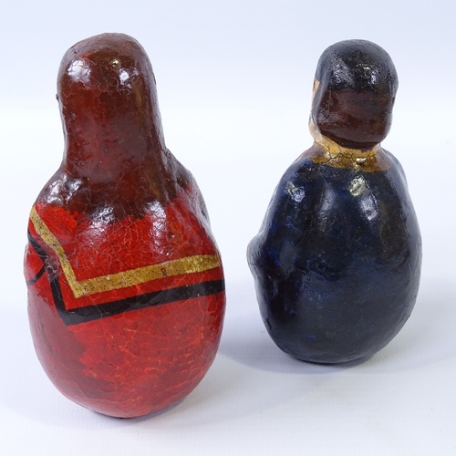 232 - A pair of unusual German Folk Art roly poly figures, circa 1850, weighted papier mache with hand pai... 