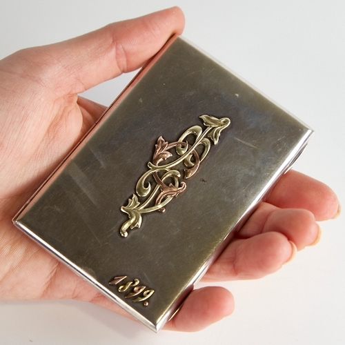 1115 - FABERGE - a 19th century Russian silver calling card case, plain rectangular form with applied 2-col... 