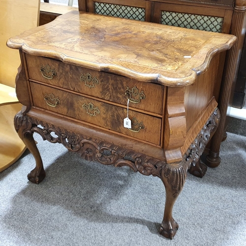 234 - A Continental crossbanded walnut chest of 2 drawers, with shaped top, carved apron and cabriole legs... 