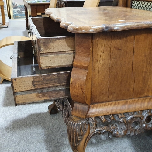 234 - A Continental crossbanded walnut chest of 2 drawers, with shaped top, carved apron and cabriole legs... 