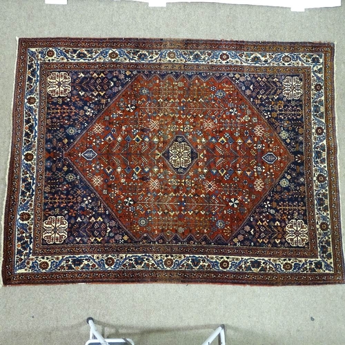 378 - A handmade Abadeh floral decorated rug, 207cm x 158cm.