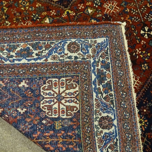 378 - A handmade Abadeh floral decorated rug, 207cm x 158cm.