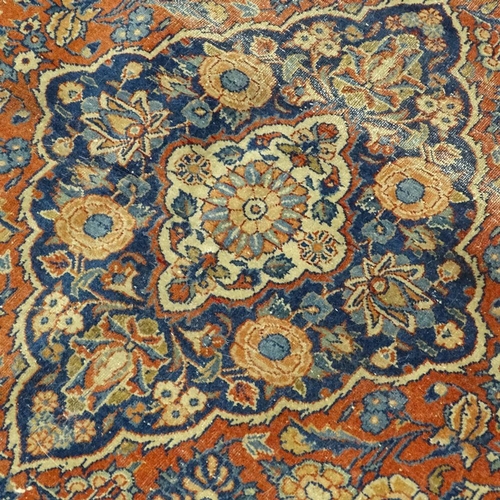 380 - An intricate antique red ground Persian rug, 200 x 135cm.