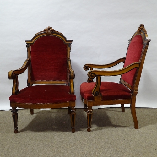 392 - A pair of 19th century walnut and ebonised library armchairs, with acanthus carved arched backs