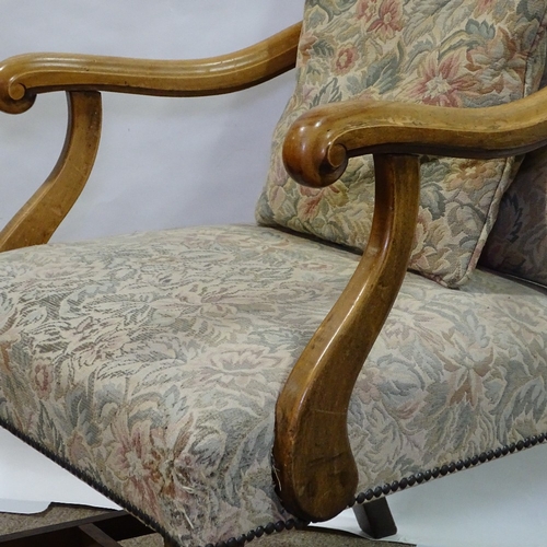 393 - A Victorian beech-framed Carolean style armchair