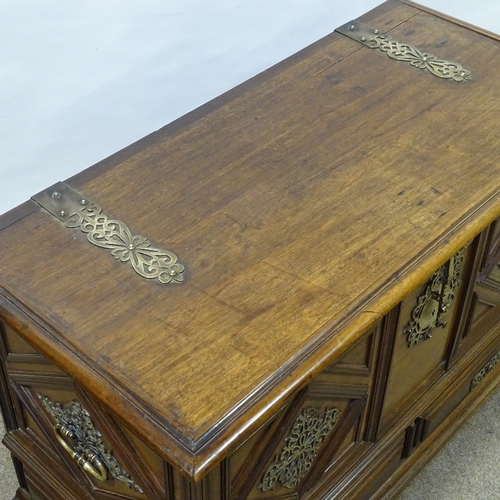 395 - A padouk wood coffer with ornate brass mouldings and mounts, and 2 drawers below, length 102cm, heig... 