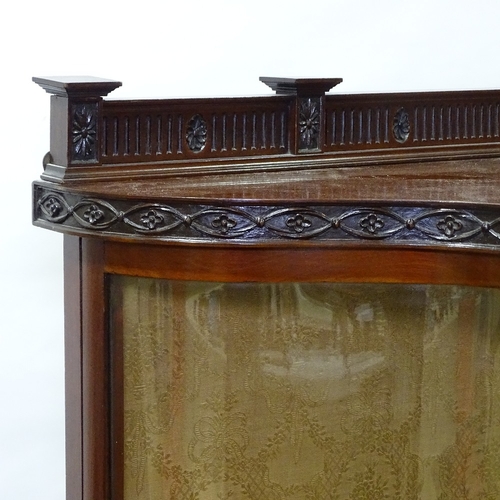 397 - An Edwardian mahogany serpentine-front display cabinet, with carved friezes and serpentine glass pan... 