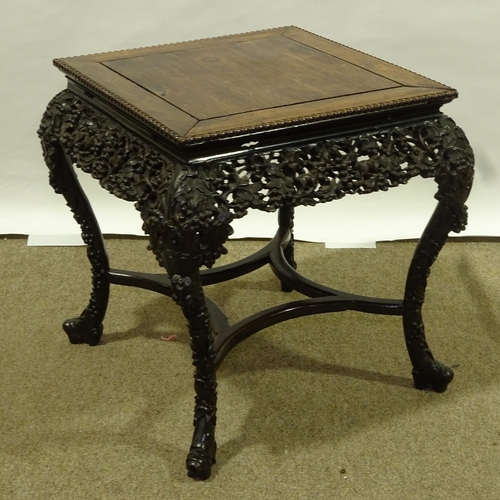 81 - A 19th century Chinese hardwood square centre table, with beaded edge and relief carved and pierced ... 