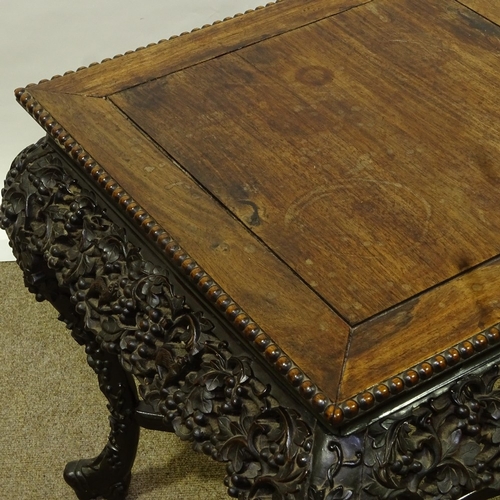 81 - A 19th century Chinese hardwood square centre table, with beaded edge and relief carved and pierced ... 
