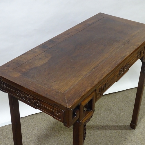 82 - A 19th century Chinese hardwood altar table with relief carved frieze, central frieze drawer raised ... 