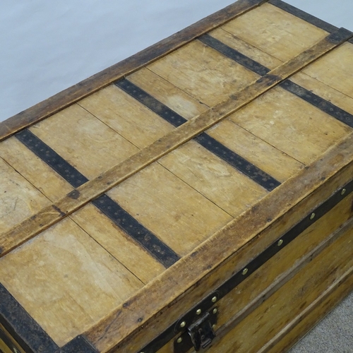 85 - LOUIS VUITTON - Vintage wood and metal-bound travelling trunk, metal carrying handles, original pape... 