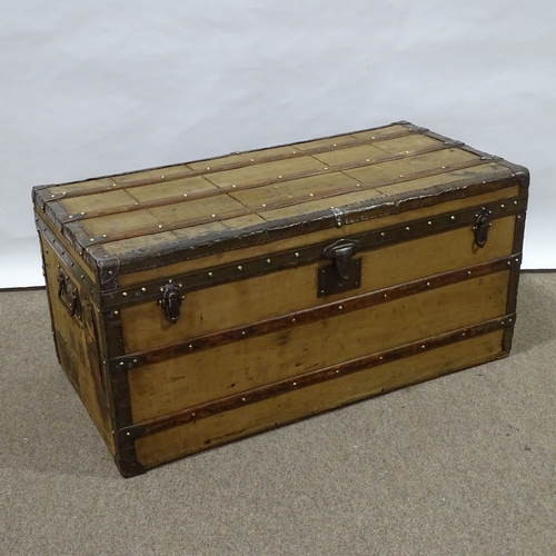 85 - LOUIS VUITTON - Vintage wood and metal-bound travelling trunk, metal carrying handles, original pape... 