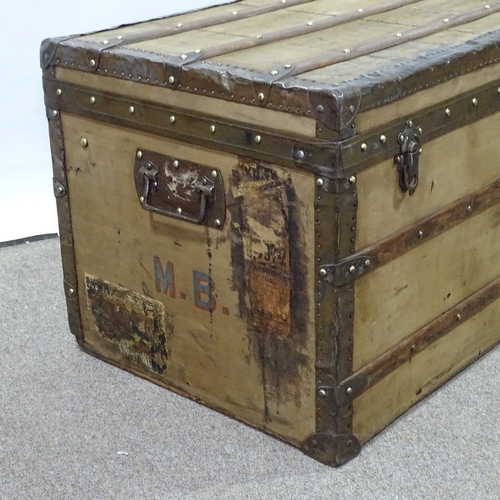 85 - LOUIS VUITTON - Vintage wood and metal-bound travelling trunk, metal carrying handles, original pape... 