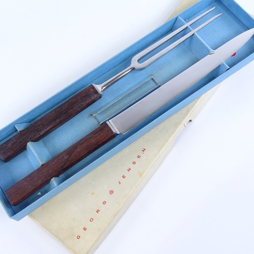 2008 - GEORG JENSEN, stainless steel carving set with wooden handles in original box, knife length 36.5cm.