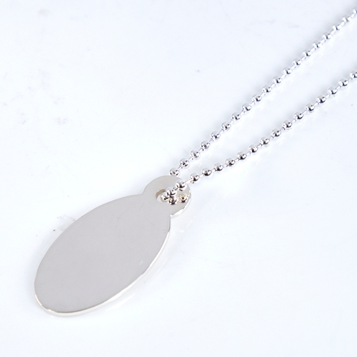 1661 - TIFFIANY & CO - a modern sterling silver Return To Tiffany oval pendant necklace, on original silver... 