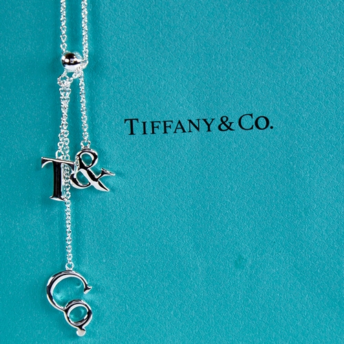 1665 - ELSA PERETTI for TIFFANY & CO - a modern sterling silver T&Co lariat pendant necklace, chain length ... 