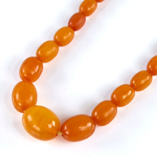 1668 - A Vintage single-strand polished butterscotch amber bead necklace, beads ranging from 17.1mm to 7.5m... 