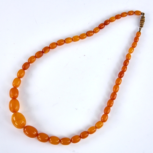 1668 - A Vintage single-strand polished butterscotch amber bead necklace, beads ranging from 17.1mm to 7.5m... 