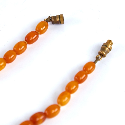 1668 - A Vintage single-strand polished butterscotch amber bead necklace, beads ranging from 17.1mm to 7.5m... 