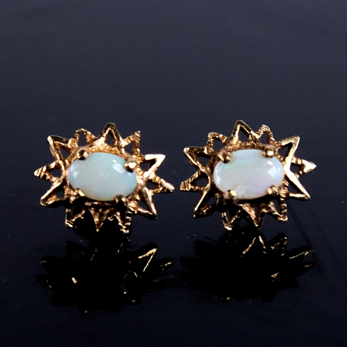 1669 - A pair of late 20th century 9ct gold cabochon opal starburst earrings, earring height 13.9mm, 1.8g