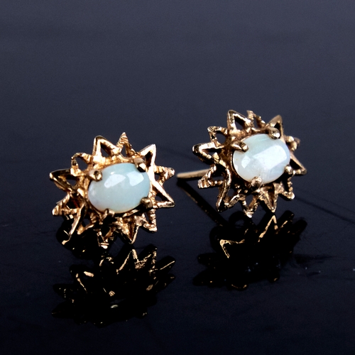 1669 - A pair of late 20th century 9ct gold cabochon opal starburst earrings, earring height 13.9mm, 1.8g