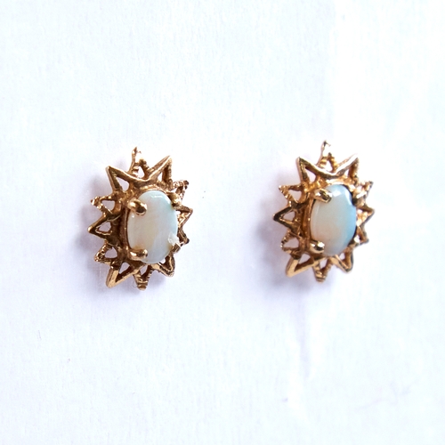 1669 - A pair of late 20th century 9ct gold cabochon opal starburst earrings, earring height 13.9mm, 1.8g