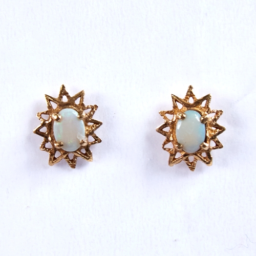 1669 - A pair of late 20th century 9ct gold cabochon opal starburst earrings, earring height 13.9mm, 1.8g