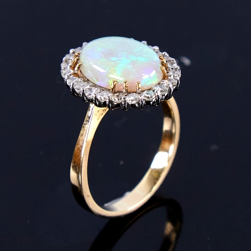 1670 - A large late 20th century 18ct gold cabochon opal and diamond cluster ring, set with oval cabochon o... 