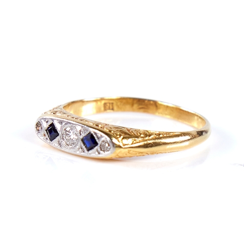 1676 - An early 20th century 18ct gold graduated 5-stone sapphire and diamond half hoop ring, set with roun... 