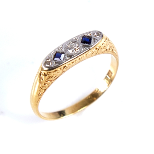 1676 - An early 20th century 18ct gold graduated 5-stone sapphire and diamond half hoop ring, set with roun... 