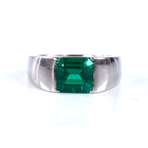 1677 - A Colombian emerald ring, rectangular emerald-cut emerald weighing approx 2.42ct bezel-set in heavy ... 