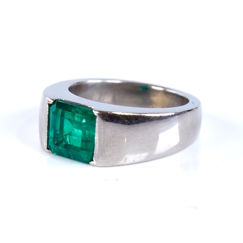 1677 - A Colombian emerald ring, rectangular emerald-cut emerald weighing approx 2.42ct bezel-set in heavy ... 