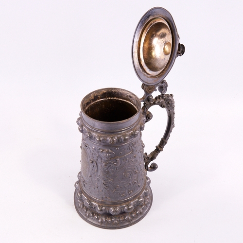 123 - A large Victorian pewter presentation lidded tankard, with relief decorated figures and inscription,... 