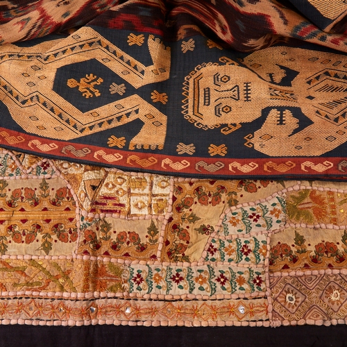 388 - East Timor Tais textile, with figural borders and centre panel, length 240cm x 66cm, together with a... 