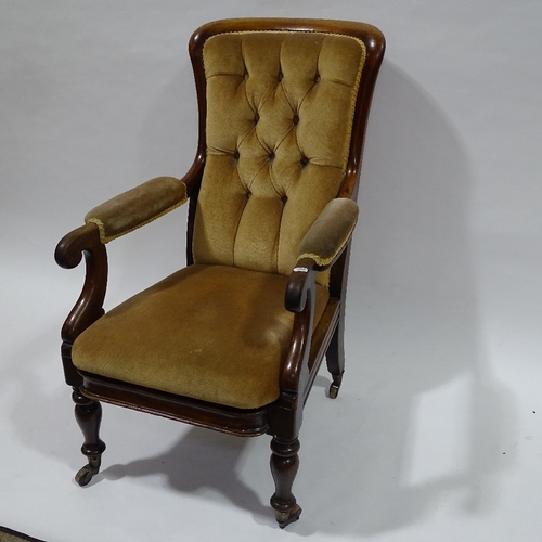 394 - A Victorian mahogany framed open arm fireside chair