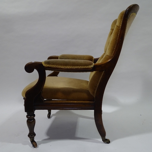 394 - A Victorian mahogany framed open arm fireside chair