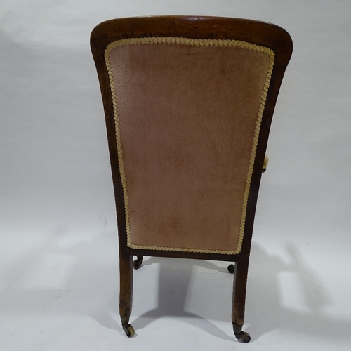 394 - A Victorian mahogany framed open arm fireside chair