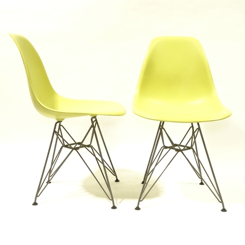 2092 - CHARLES EAMES, VITRA, a pair of mustard coloured DSR side chairs, with plastic shell seat on powder ... 