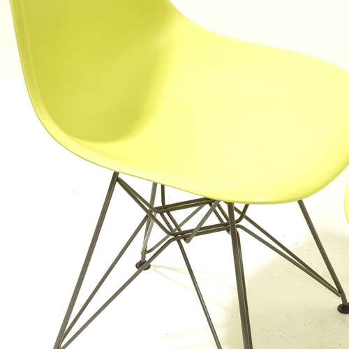 2092 - CHARLES EAMES, VITRA, a pair of mustard coloured DSR side chairs, with plastic shell seat on powder ... 