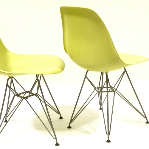 2092 - CHARLES EAMES, VITRA, a pair of mustard coloured DSR side chairs, with plastic shell seat on powder ... 