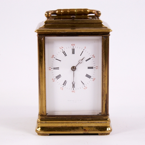 1053 - A 19th century brass-cased repeating carriage clock, white enamel dial with Roman numeral hour marke... 