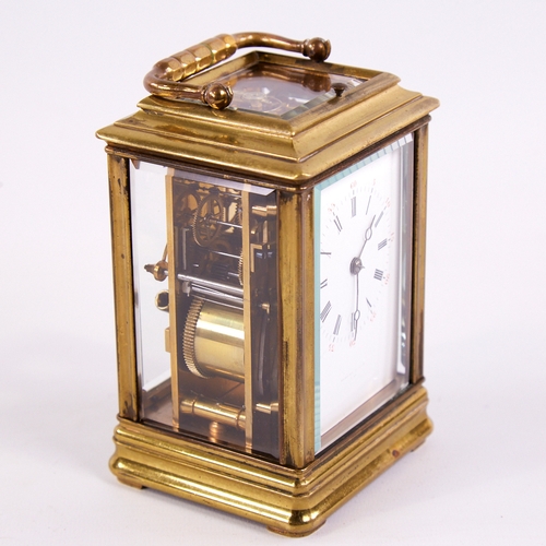 1053 - A 19th century brass-cased repeating carriage clock, white enamel dial with Roman numeral hour marke... 