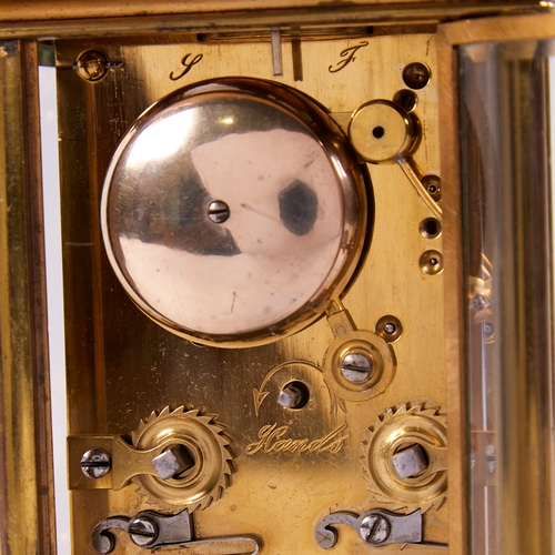 1053 - A 19th century brass-cased repeating carriage clock, white enamel dial with Roman numeral hour marke... 