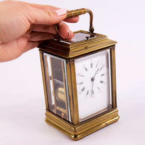 1053 - A 19th century brass-cased repeating carriage clock, white enamel dial with Roman numeral hour marke... 