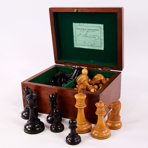141 - A Jaques carved and stained wood Staunton chess set, weighted pieces in original mahogany box with l... 