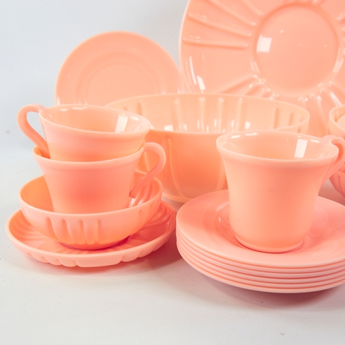 2060 - A set of Art-Deco pink plastic tableware, 32 pieces.