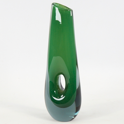 2068 - VICKE LINDSTRAND FOR KOSTA, SWEDEN, designed 1953, tall pierced vase in cased green glass, marked to... 