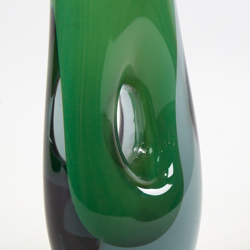 2068 - VICKE LINDSTRAND FOR KOSTA, SWEDEN, designed 1953, tall pierced vase in cased green glass, marked to... 