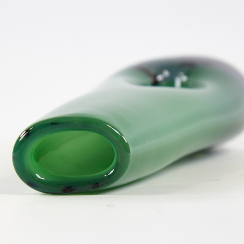 2068 - VICKE LINDSTRAND FOR KOSTA, SWEDEN, designed 1953, tall pierced vase in cased green glass, marked to... 